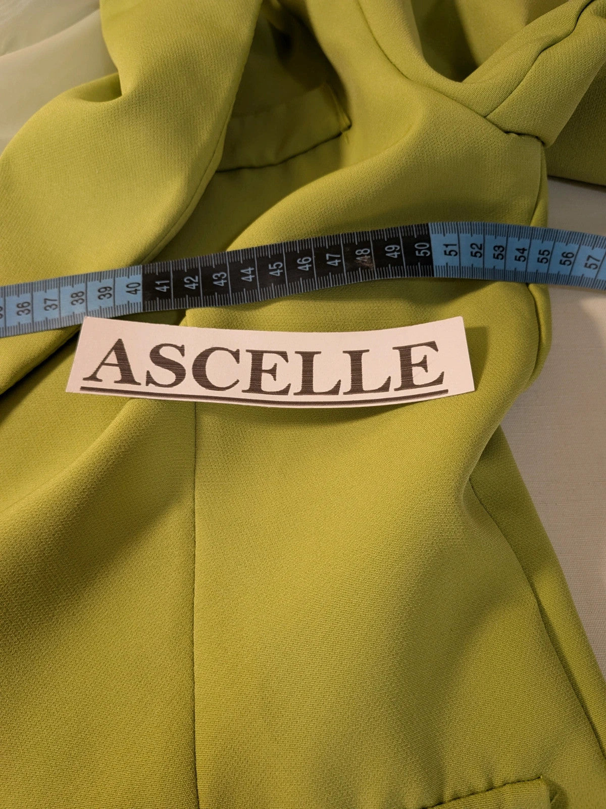 New Collection multi suit set lime green single-button blazer and straight-leg pants.
