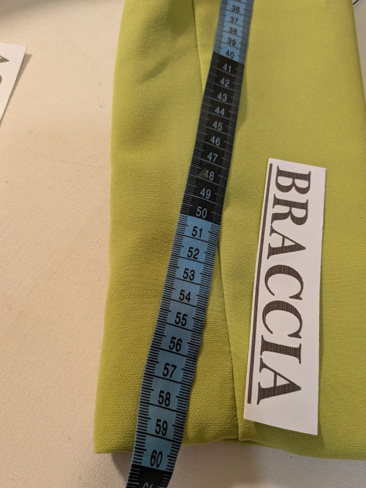 New Collection multi suit set lime green single-button blazer and straight-leg pants.