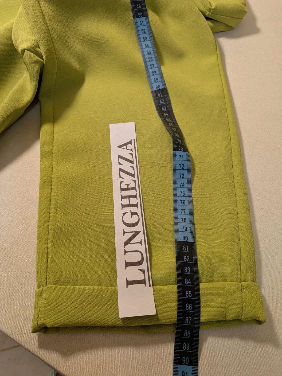 New Collection multi suit set lime green single-button blazer and straight-leg pants.