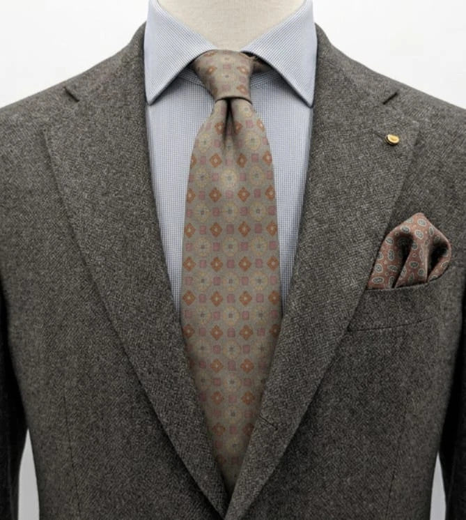 Made in Italy brown multi tie geometric floral pattern with dark blue back.