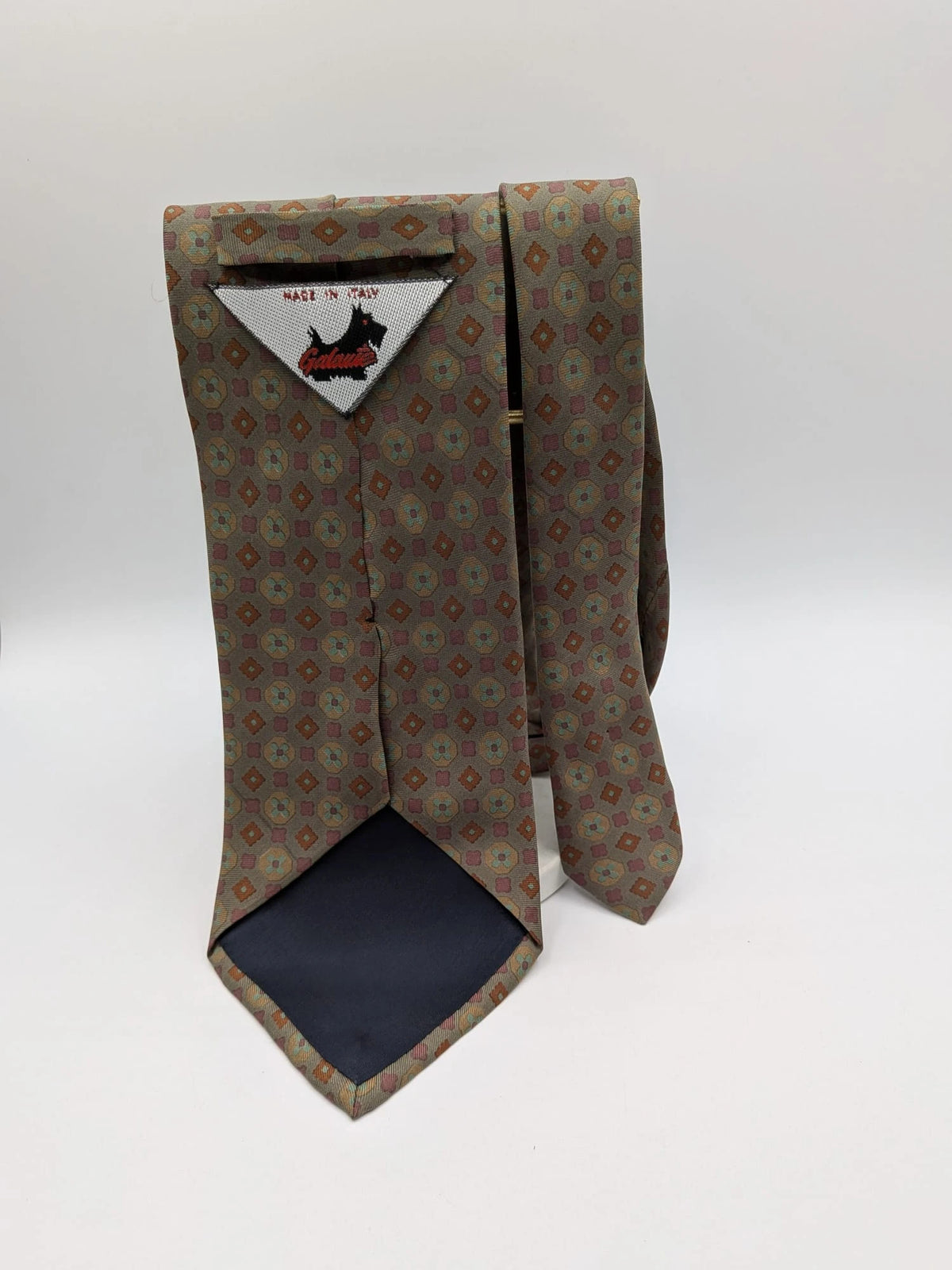 Made in Italy brown multi tie geometric floral pattern with dark blue back.
