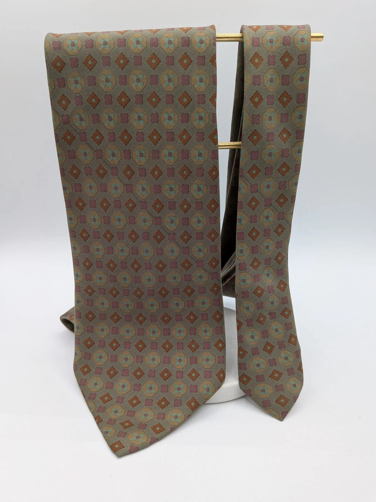 Made in Italy brown multi tie geometric floral pattern with dark blue back.