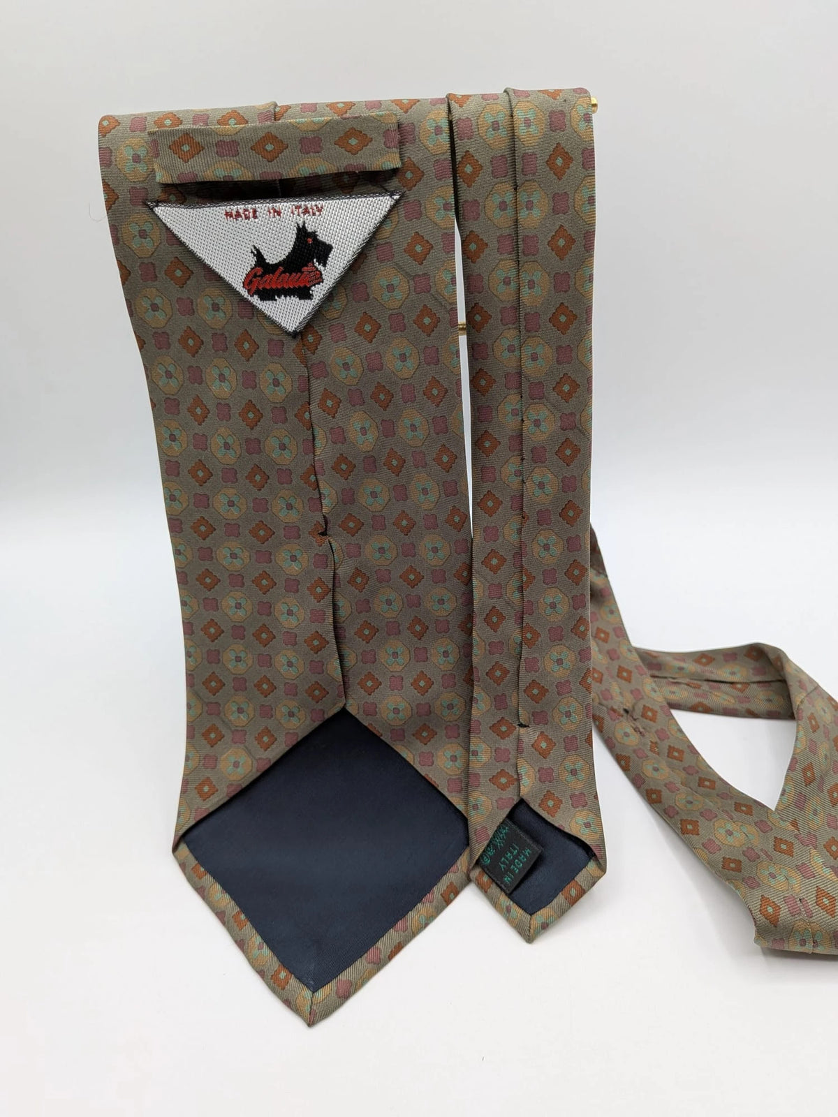 Made in Italy brown multi tie geometric floral pattern with dark blue back.