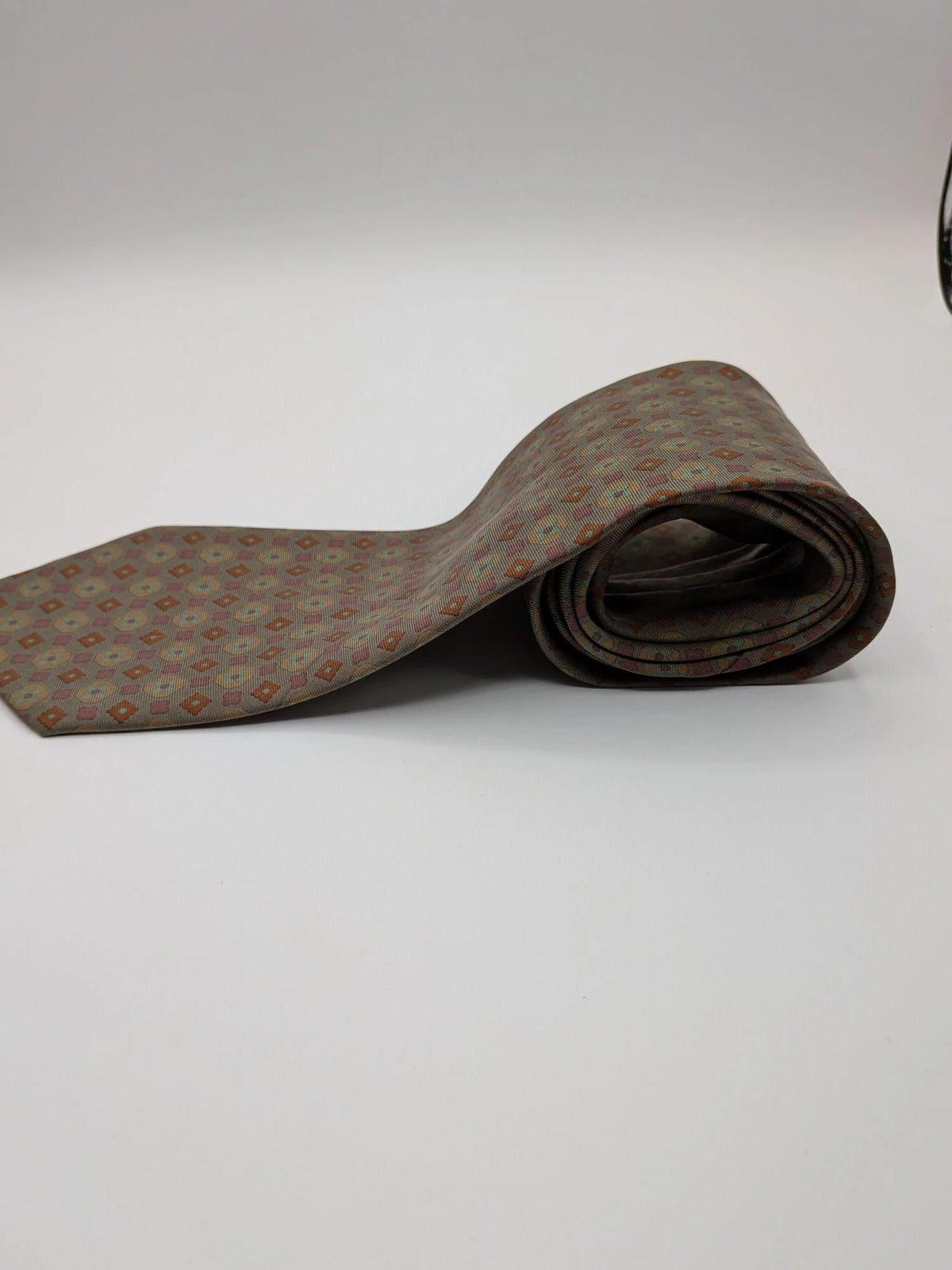 Made in Italy brown multi tie geometric floral pattern with dark blue back.