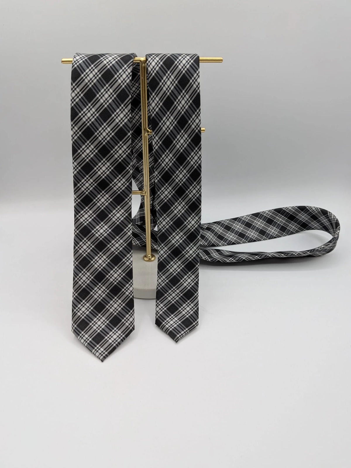 Jules tie black white gray tartan pattern 100% polyester fabric.