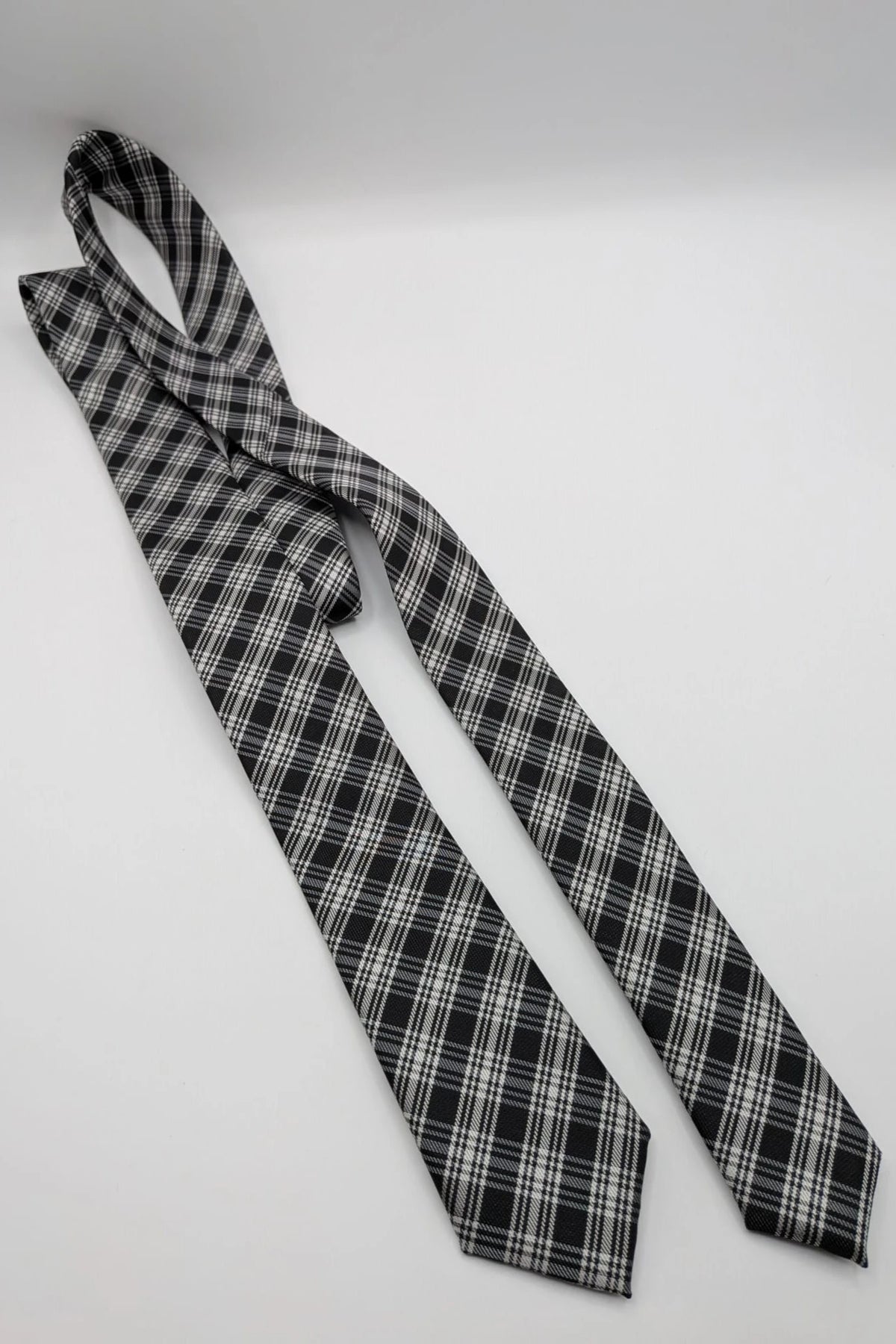 Jules tie black white gray tartan pattern 100% polyester fabric.