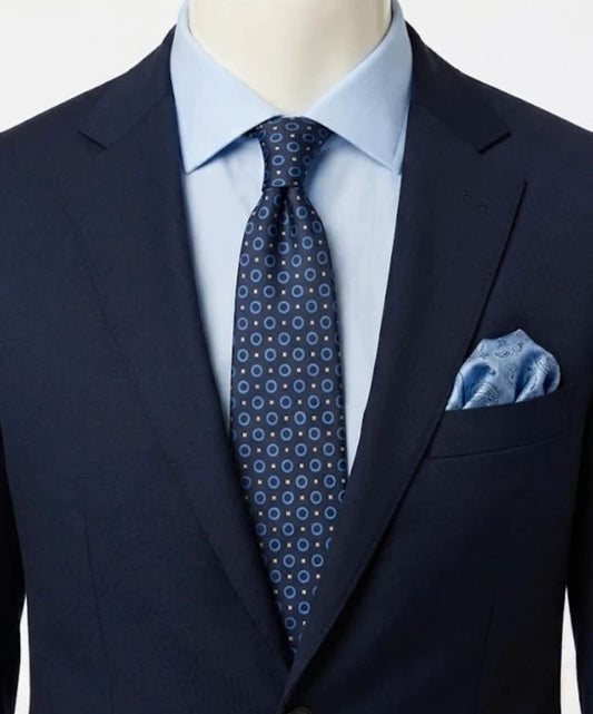Milano navy tie geometric pattern with light blue rings and beige motifs, 100% silk.