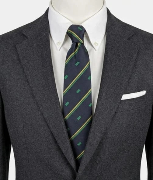 Norda tie navy blue with green and yellow diagonal stripes and geometric patterns.