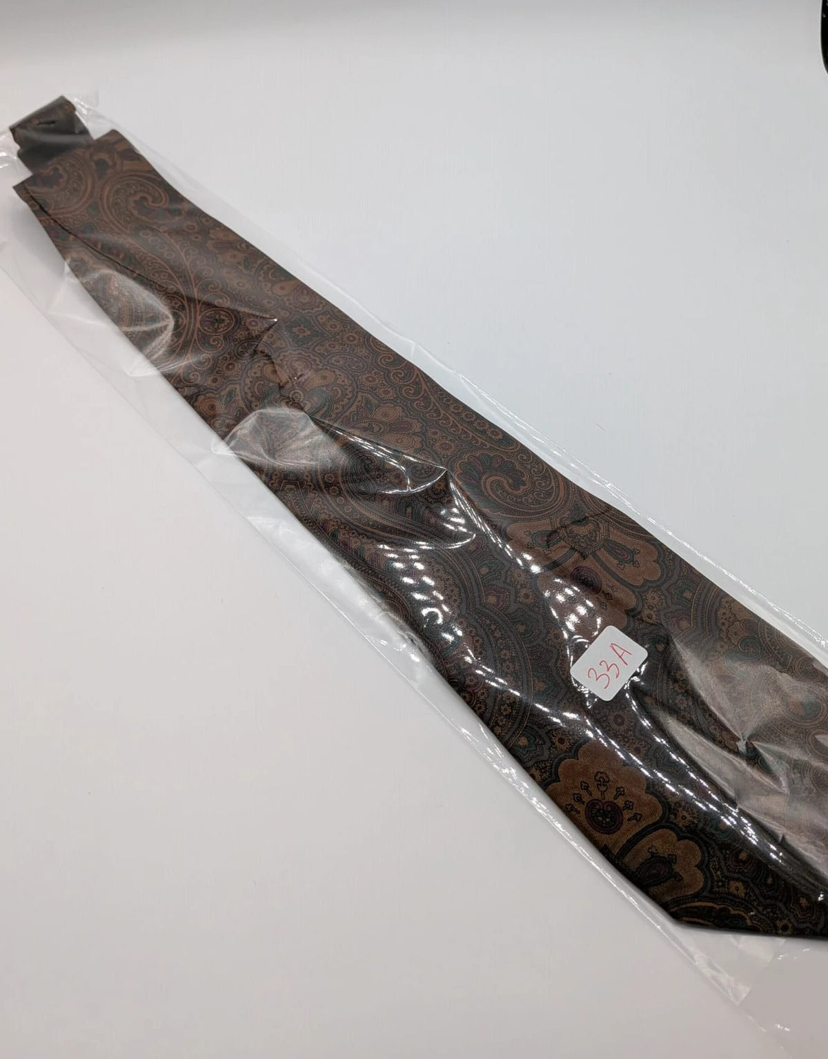 Greenfield brown paisley tie 100% silk with Made in Italy label and rich pattern.