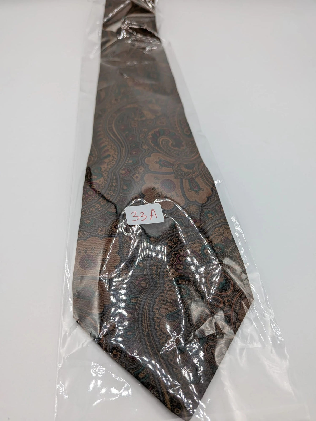 Greenfield brown paisley tie 100% silk with Made in Italy label and rich pattern.