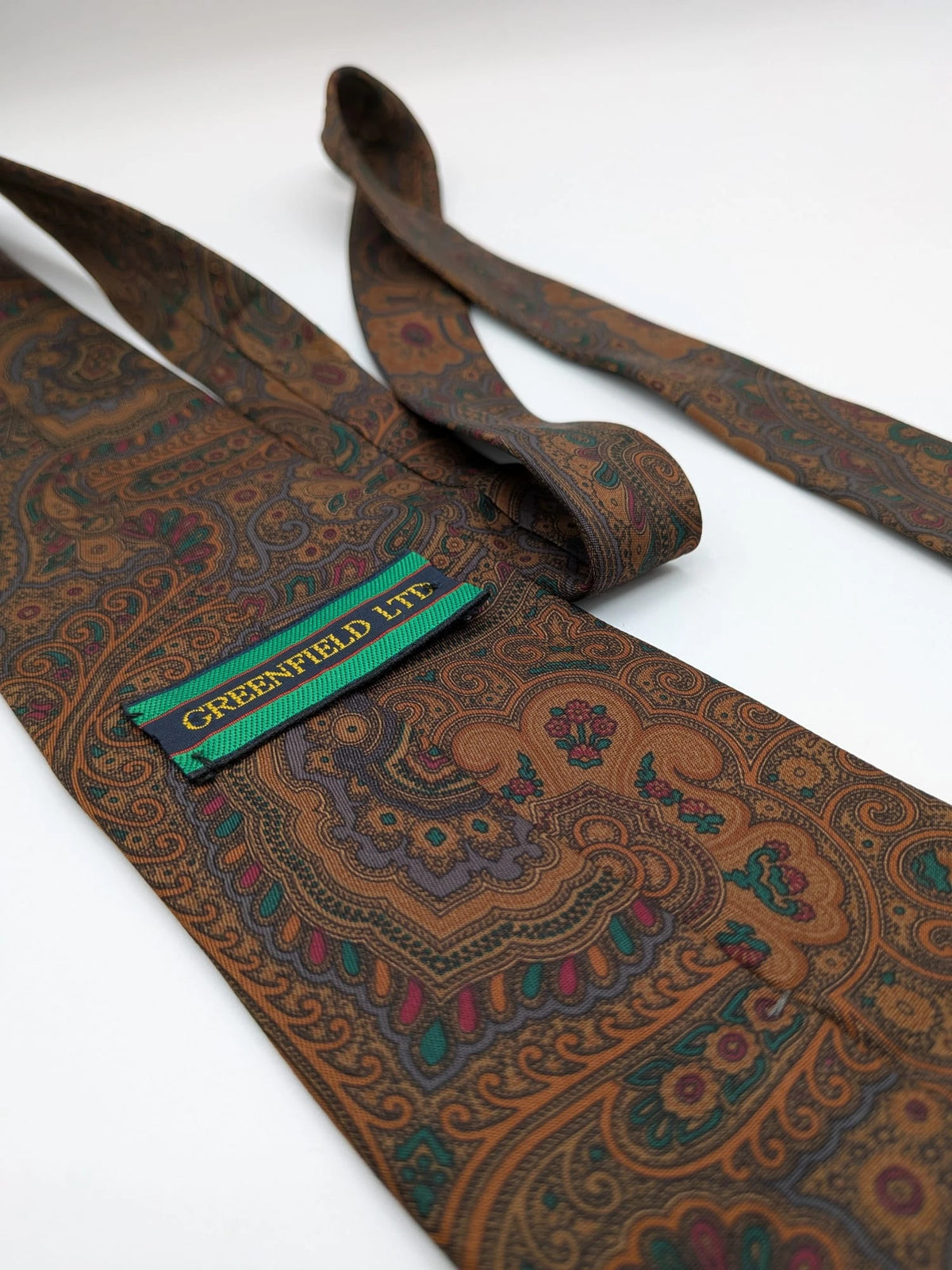 Greenfield brown paisley tie 100% silk with Made in Italy label and rich pattern.