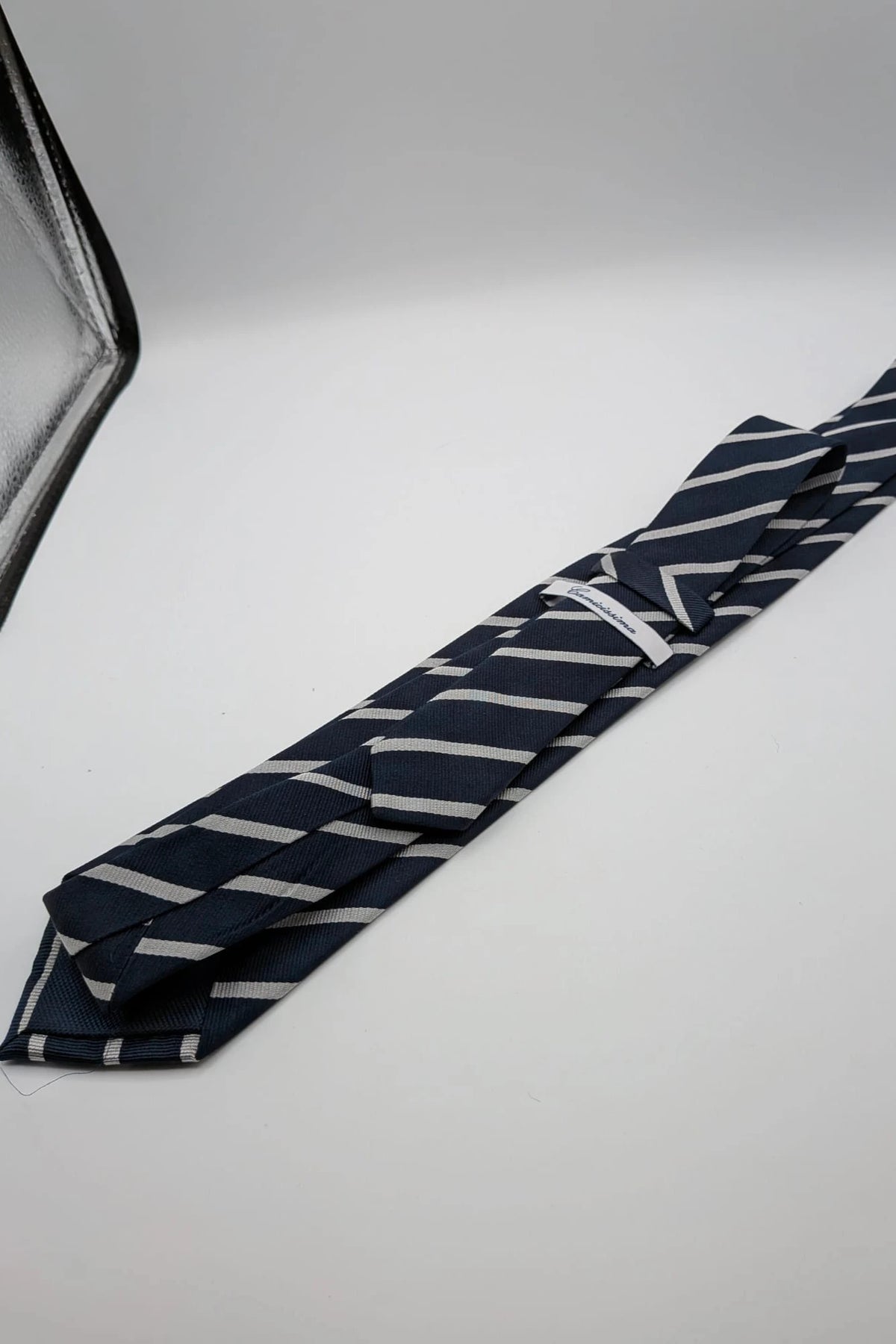 Camcissima navy tie 100% silk with white diagonal stripes and classic design.