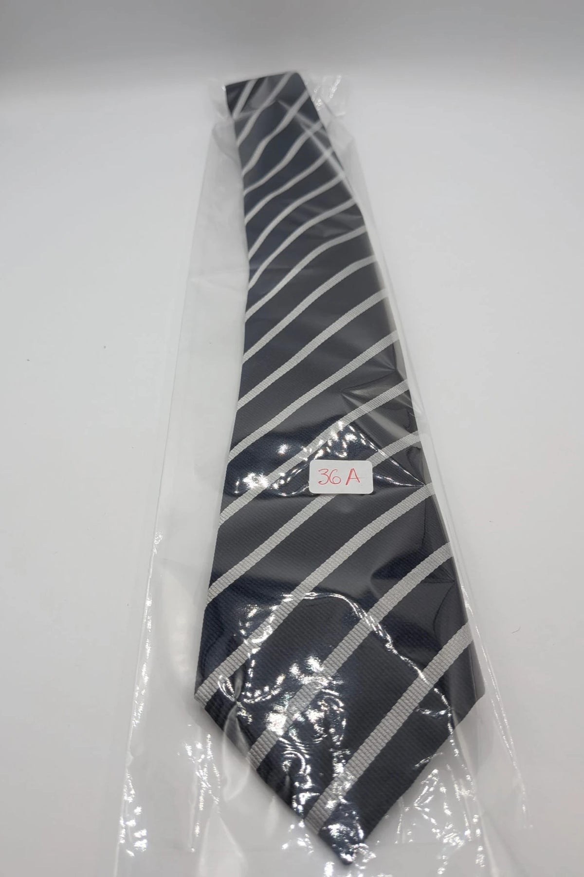 Camcissima navy tie 100% silk with white diagonal stripes and classic design.