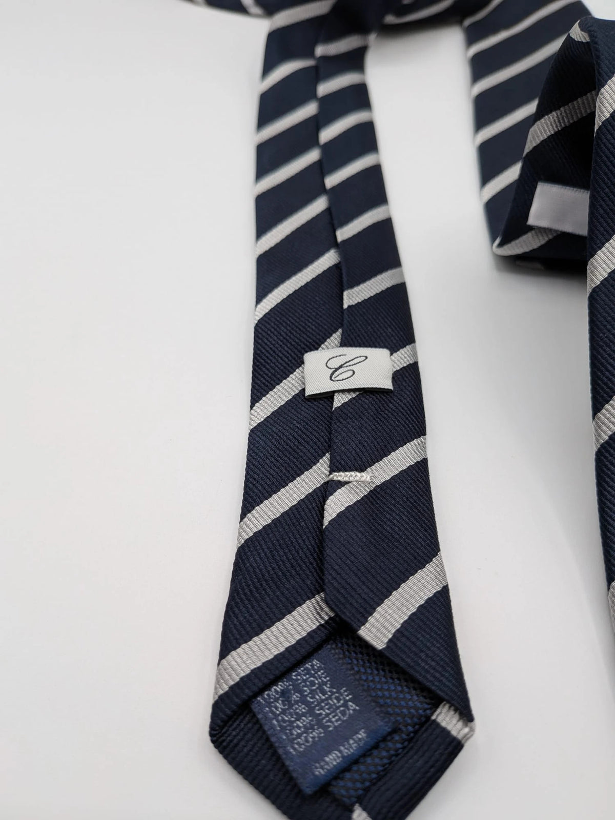 Camcissima navy tie 100% silk with white diagonal stripes and classic design.