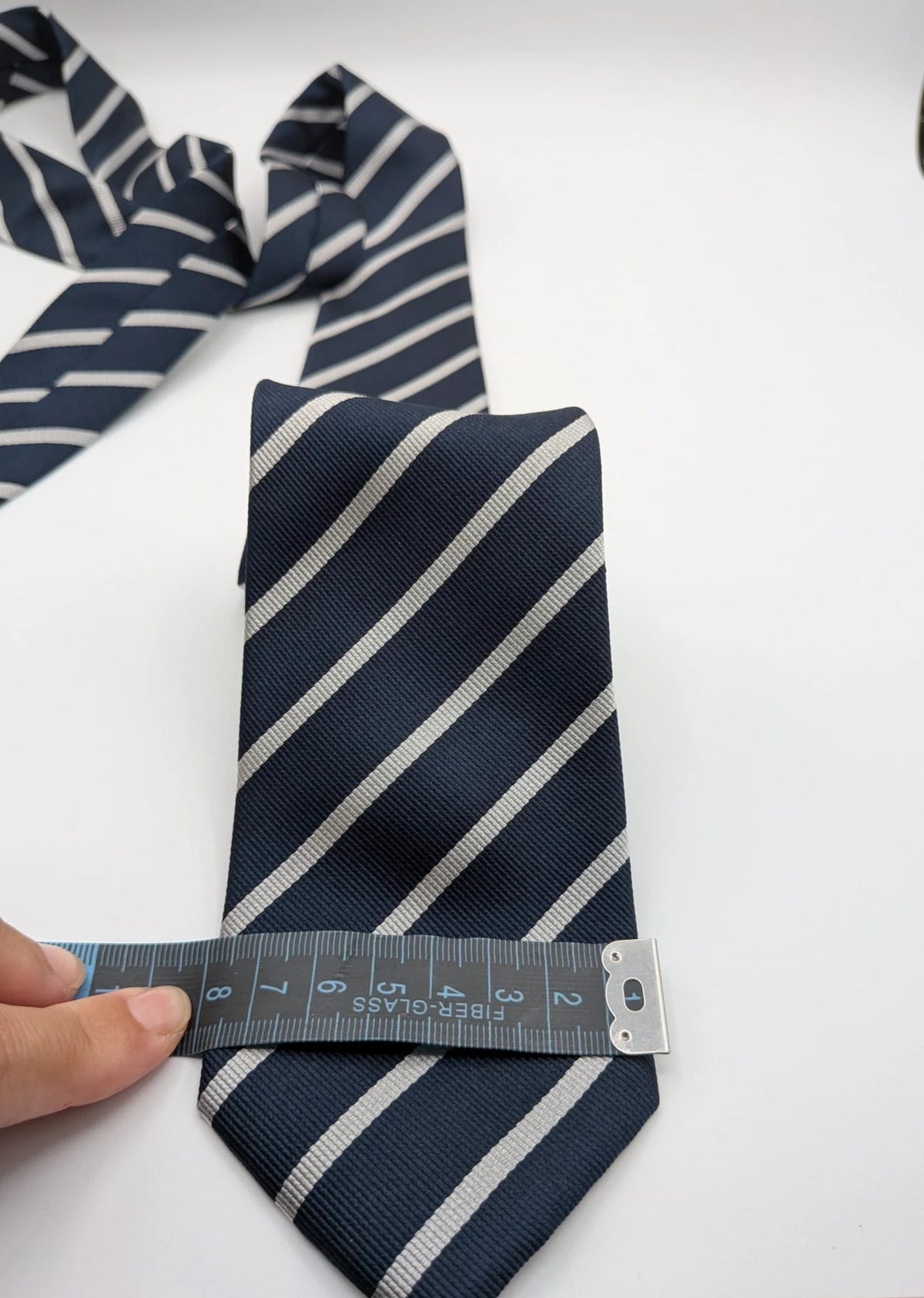 Camcissima navy tie 100% silk with white diagonal stripes and classic design.