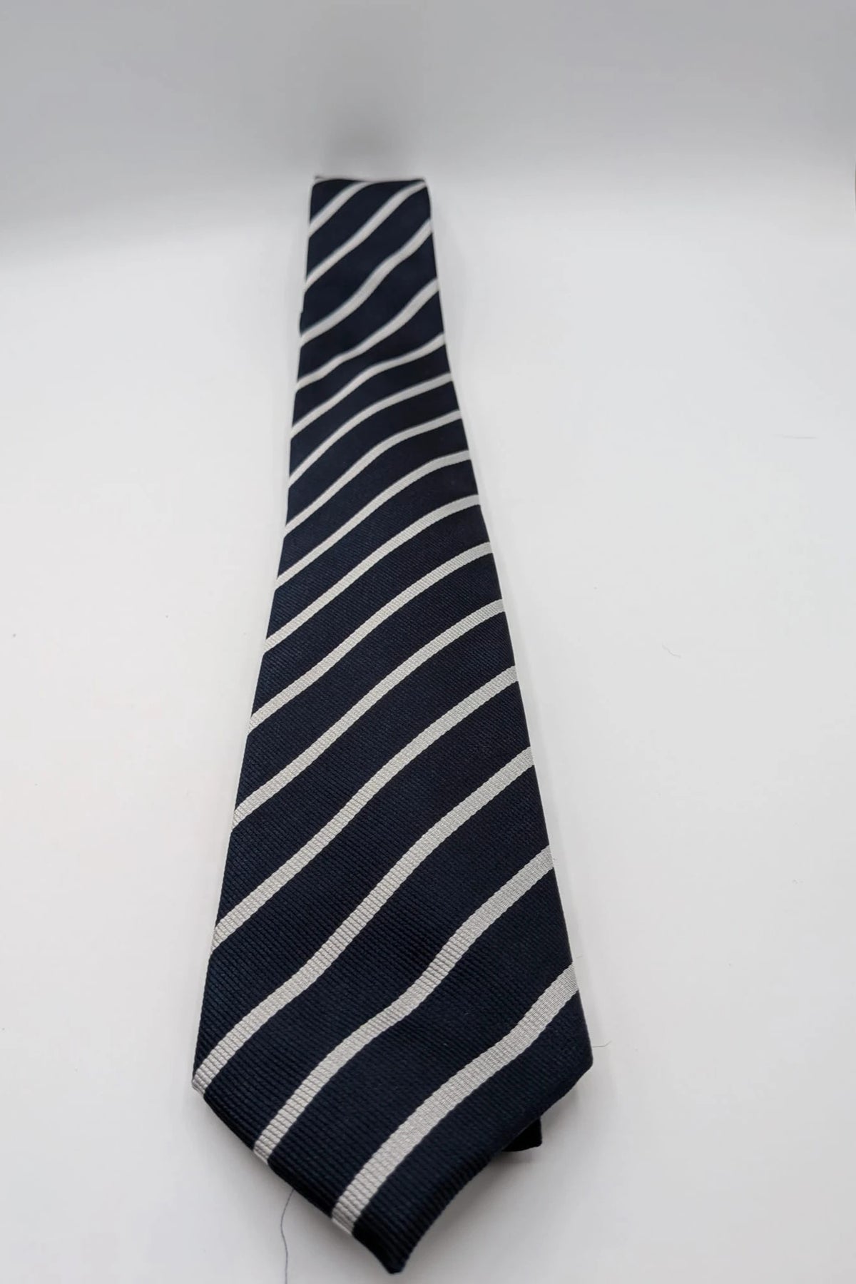 Camcissima navy tie 100% silk with white diagonal stripes and classic design.