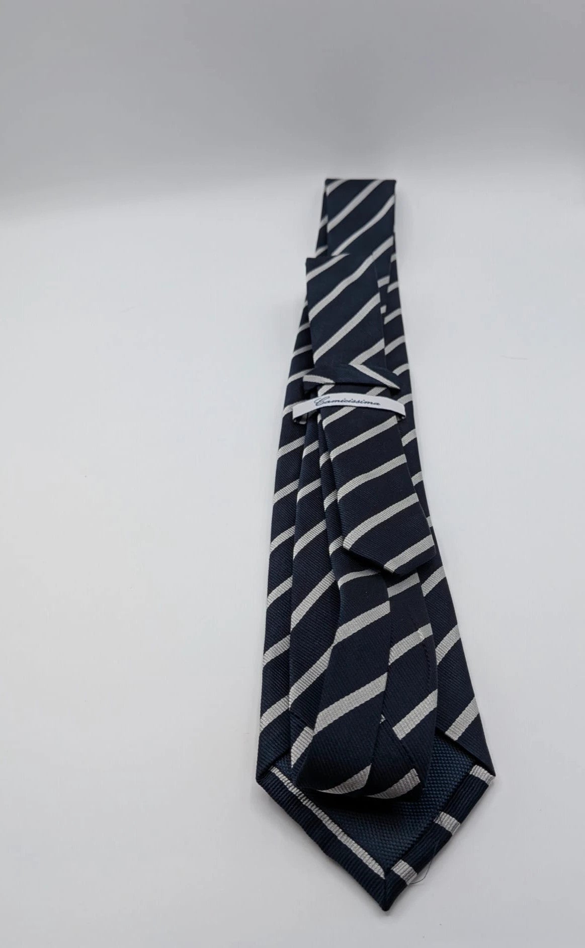 Camcissima navy tie 100% silk with white diagonal stripes and classic design.