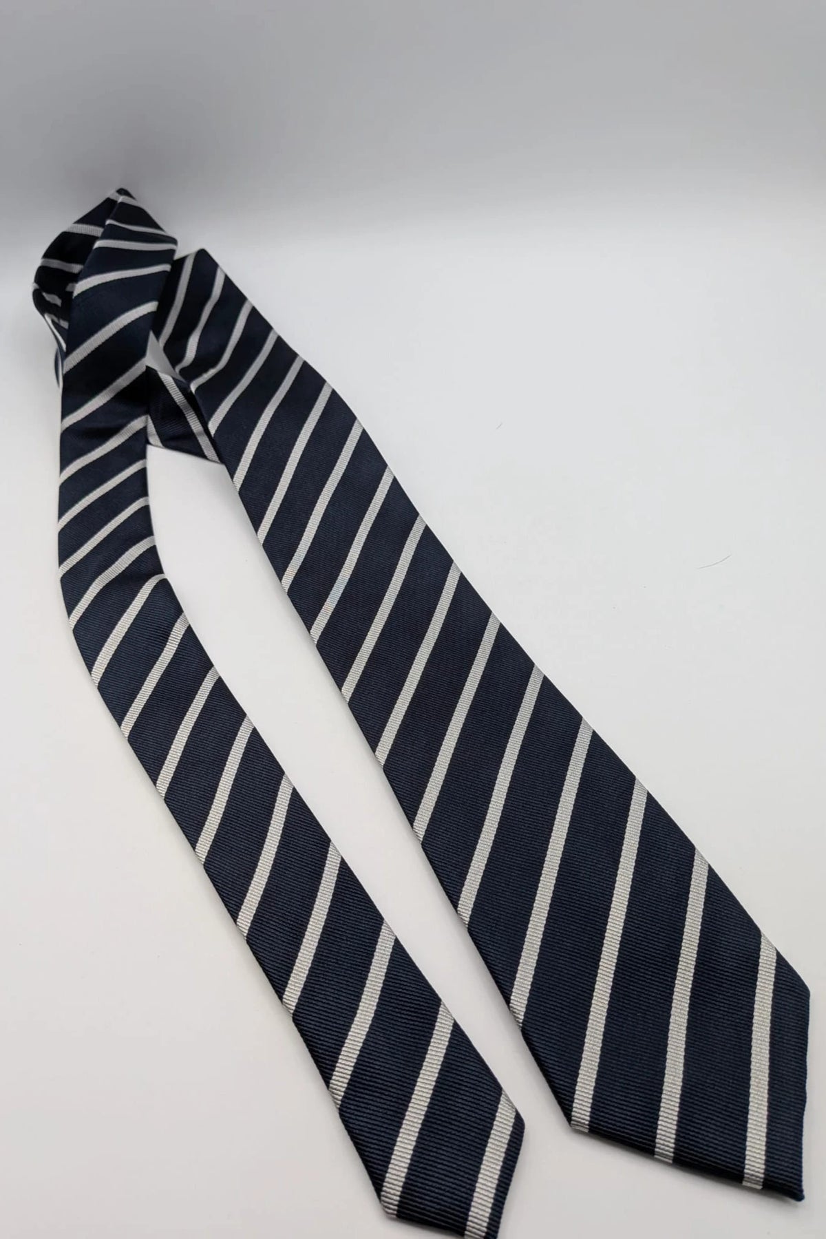 Camcissima navy tie 100% silk with white diagonal stripes and classic design.