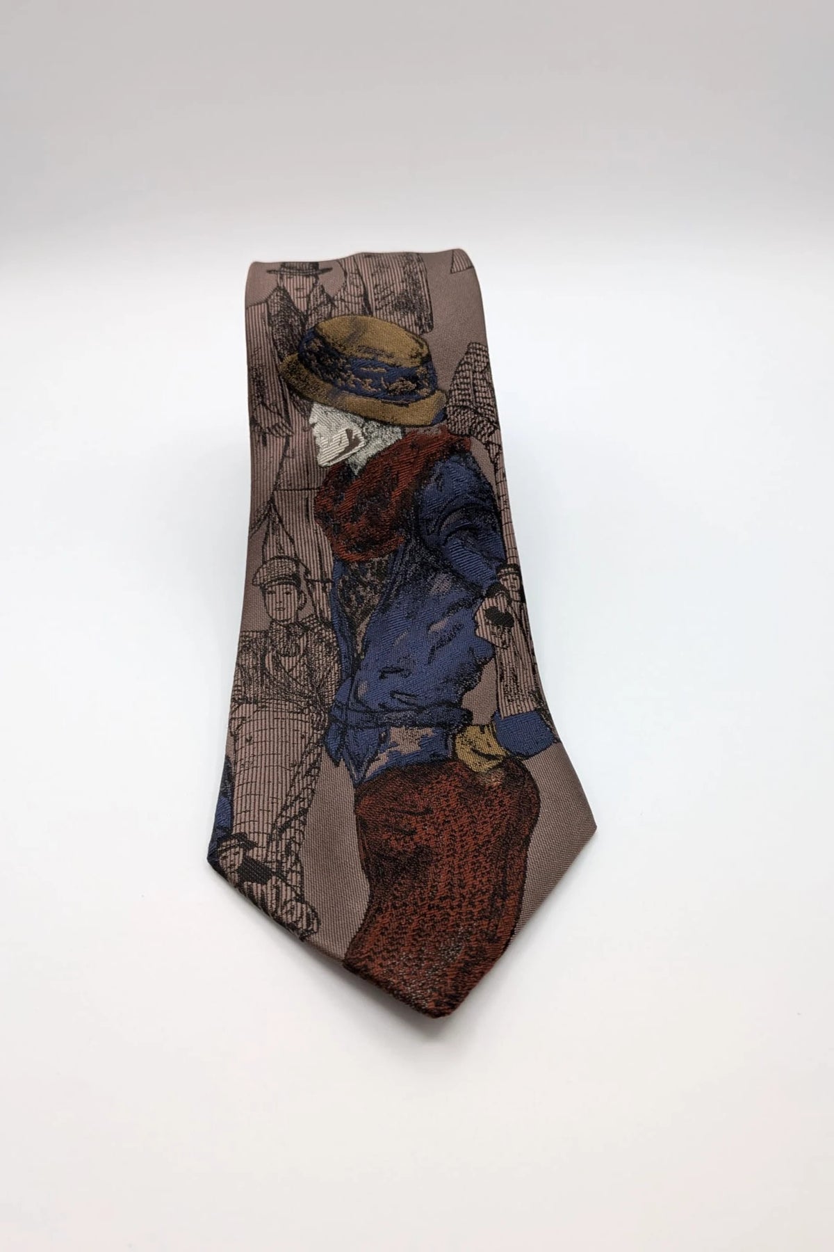 Uomo brown tie vintage illustrated pattern with blue, bordeaux, and ochre details.