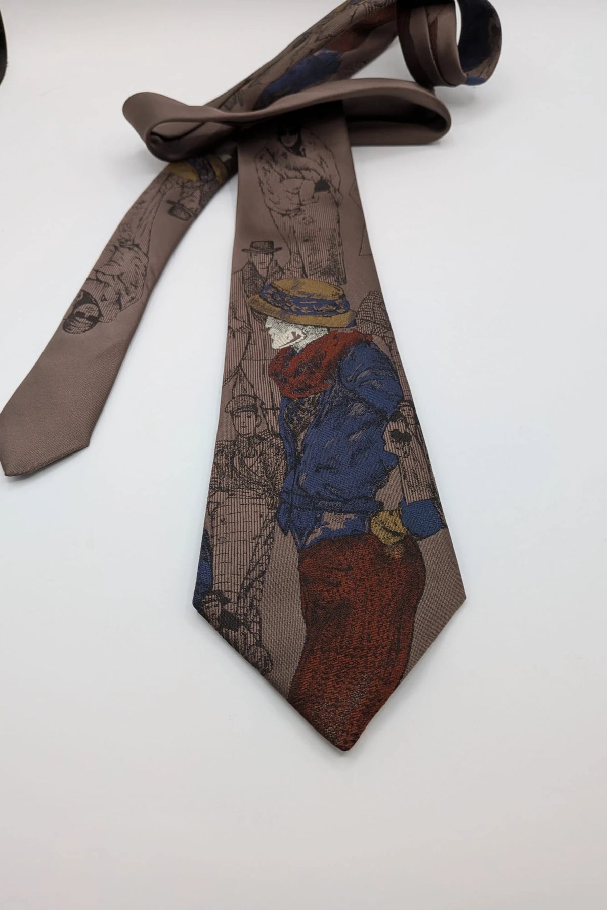Uomo brown tie vintage illustrated pattern with blue, bordeaux, and ochre details.