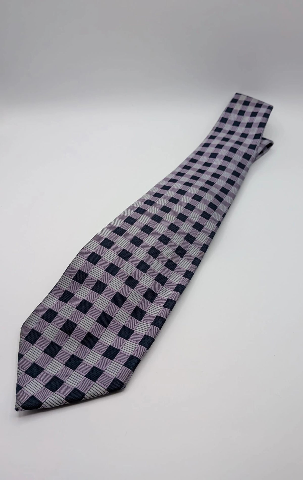 Uomo navy tie 100% silk geometric plaid pattern in purple and gray.