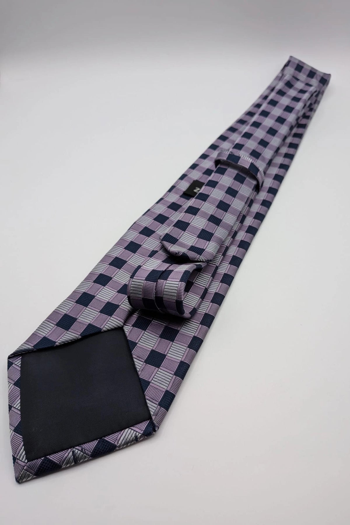 Uomo navy tie 100% silk geometric plaid pattern in purple and gray.