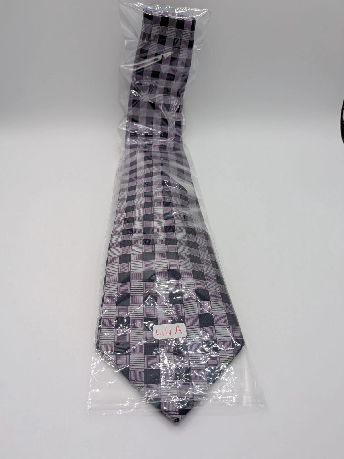Uomo navy tie 100% silk geometric plaid pattern in purple and gray.