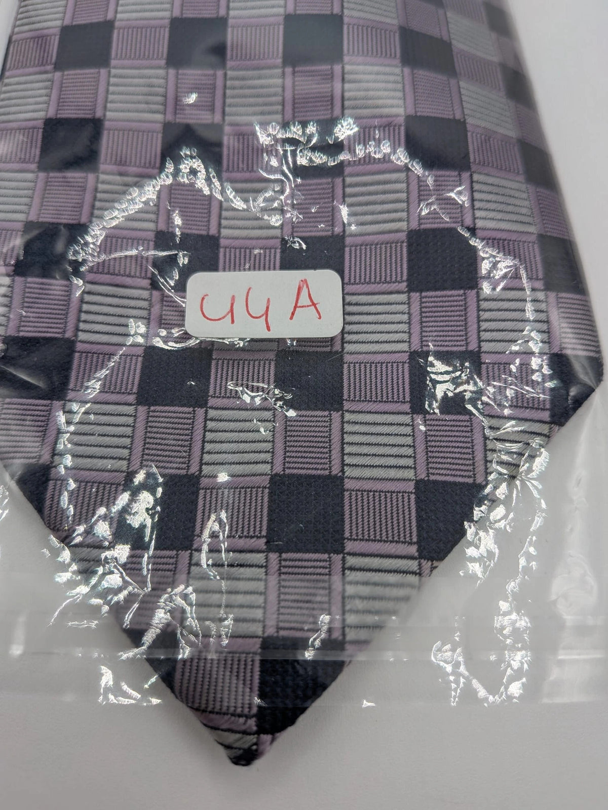 Uomo navy tie 100% silk geometric plaid pattern in purple and gray.