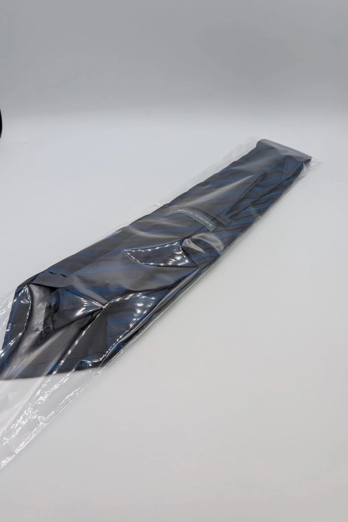 Uomo blue striped tie 100% silk with diagonal light blue and navy stripes.