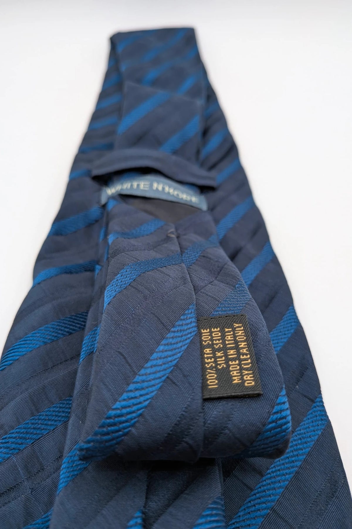 Uomo blue striped tie 100% silk with diagonal light blue and navy stripes.