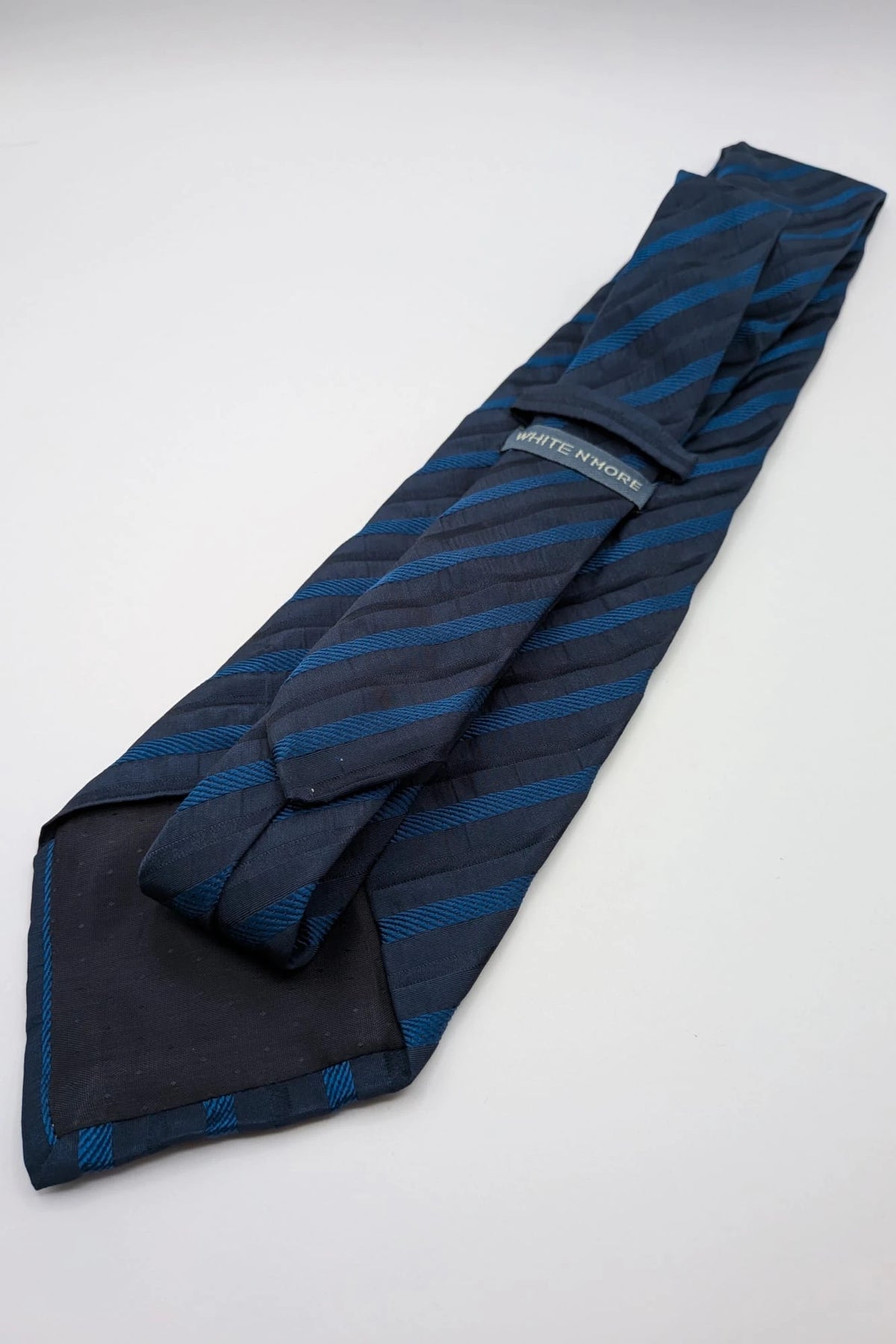 Uomo blue striped tie 100% silk with diagonal light blue and navy stripes.