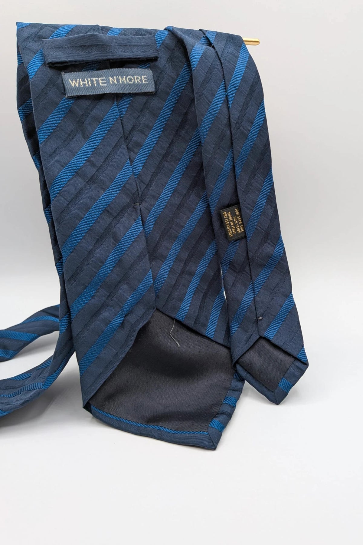 Uomo blue striped tie 100% silk with diagonal light blue and navy stripes.