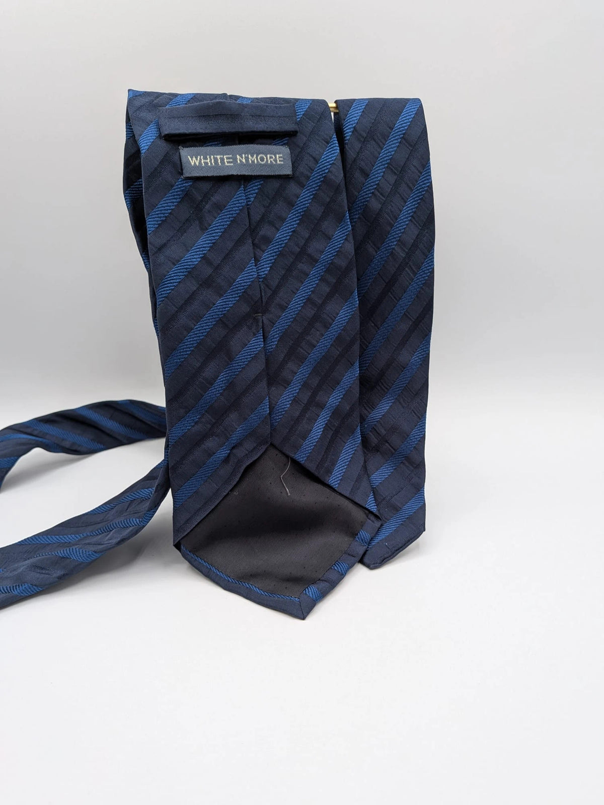 Uomo blue striped tie 100% silk with diagonal light blue and navy stripes.