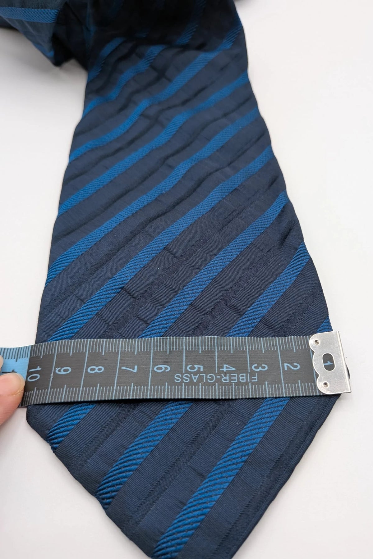 Uomo blue striped tie 100% silk with diagonal light blue and navy stripes.