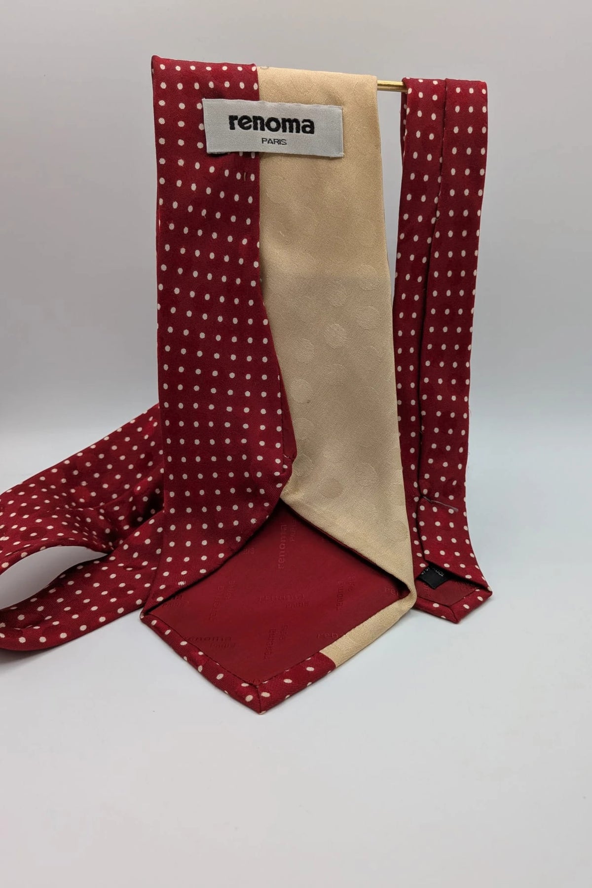 Renoma beige and burgundy tie with ivory polka dots and abstract blue-green designs.