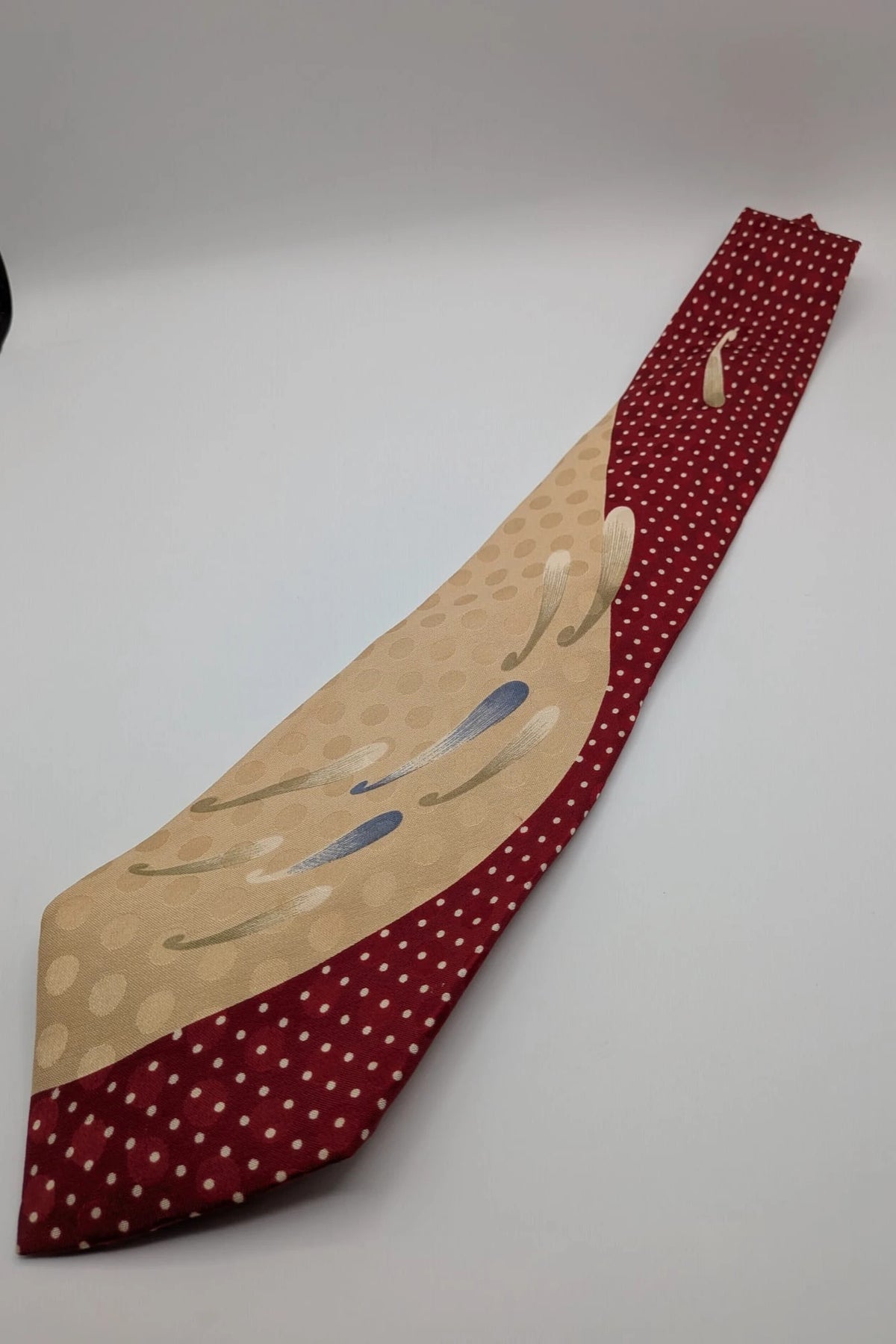 Renoma beige and burgundy tie with ivory polka dots and abstract blue-green designs.