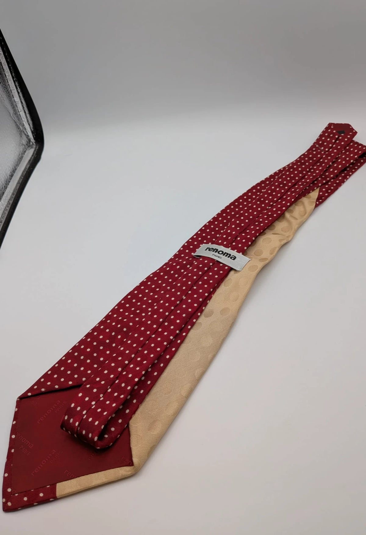 Renoma beige and burgundy tie with ivory polka dots and abstract blue-green designs.