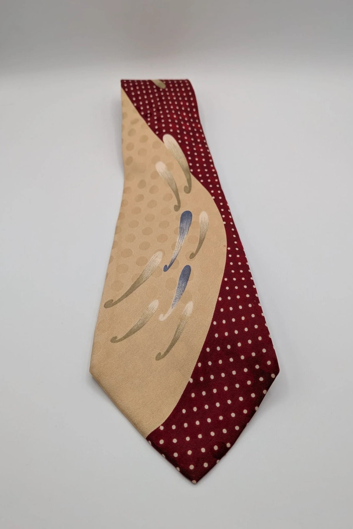 Renoma beige and burgundy tie with ivory polka dots and abstract blue-green designs.