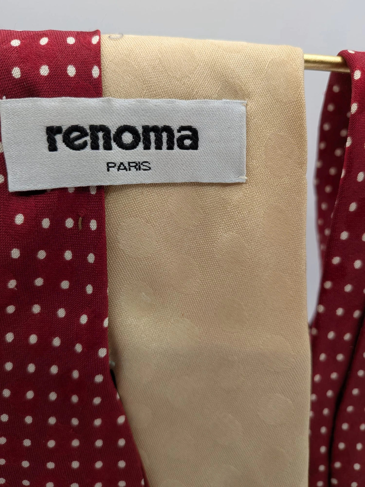 Renoma beige and burgundy tie with ivory polka dots and abstract blue-green designs.