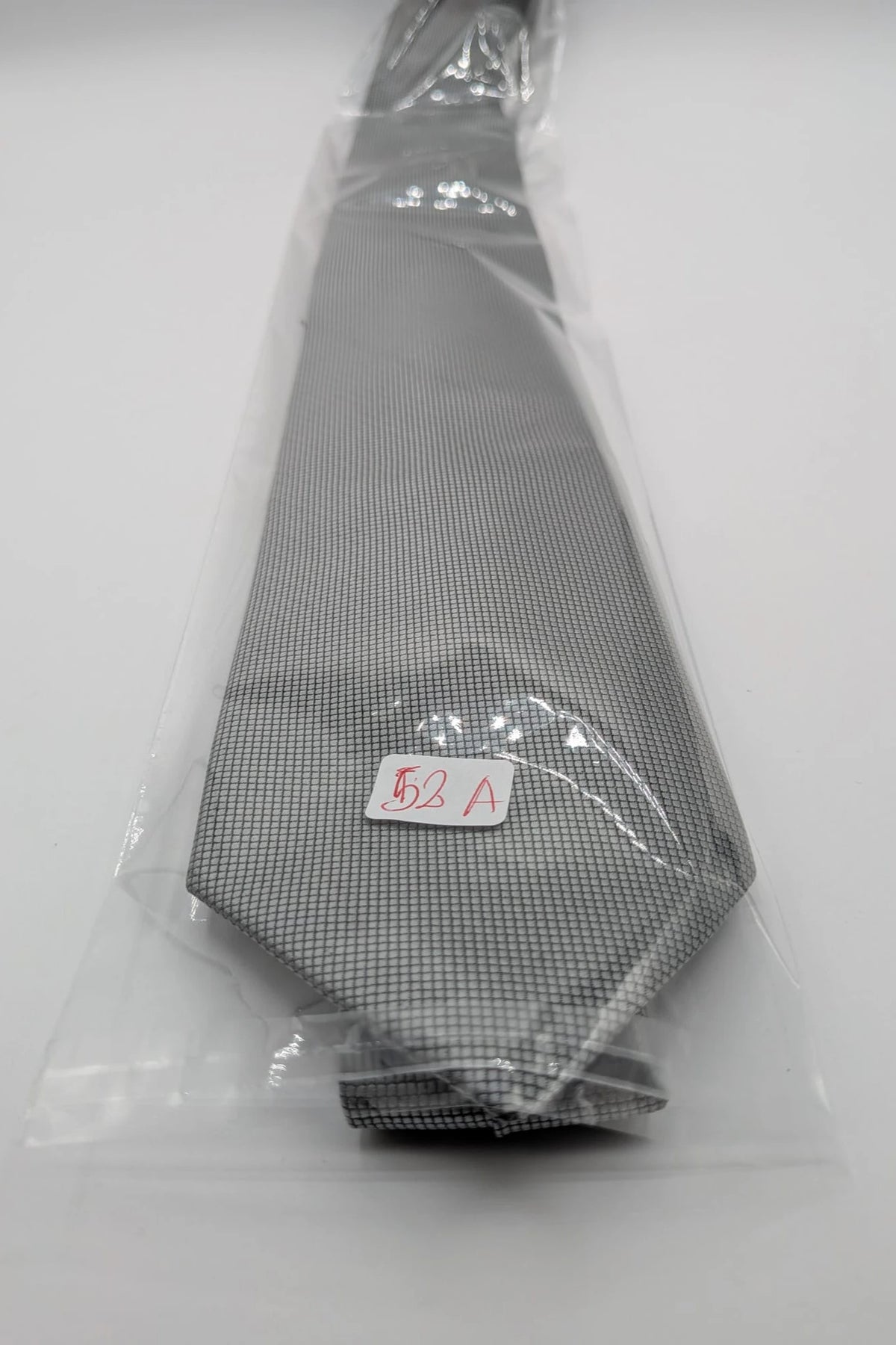 Cotton & Silk grey tie with black micro check pattern and polyester material.