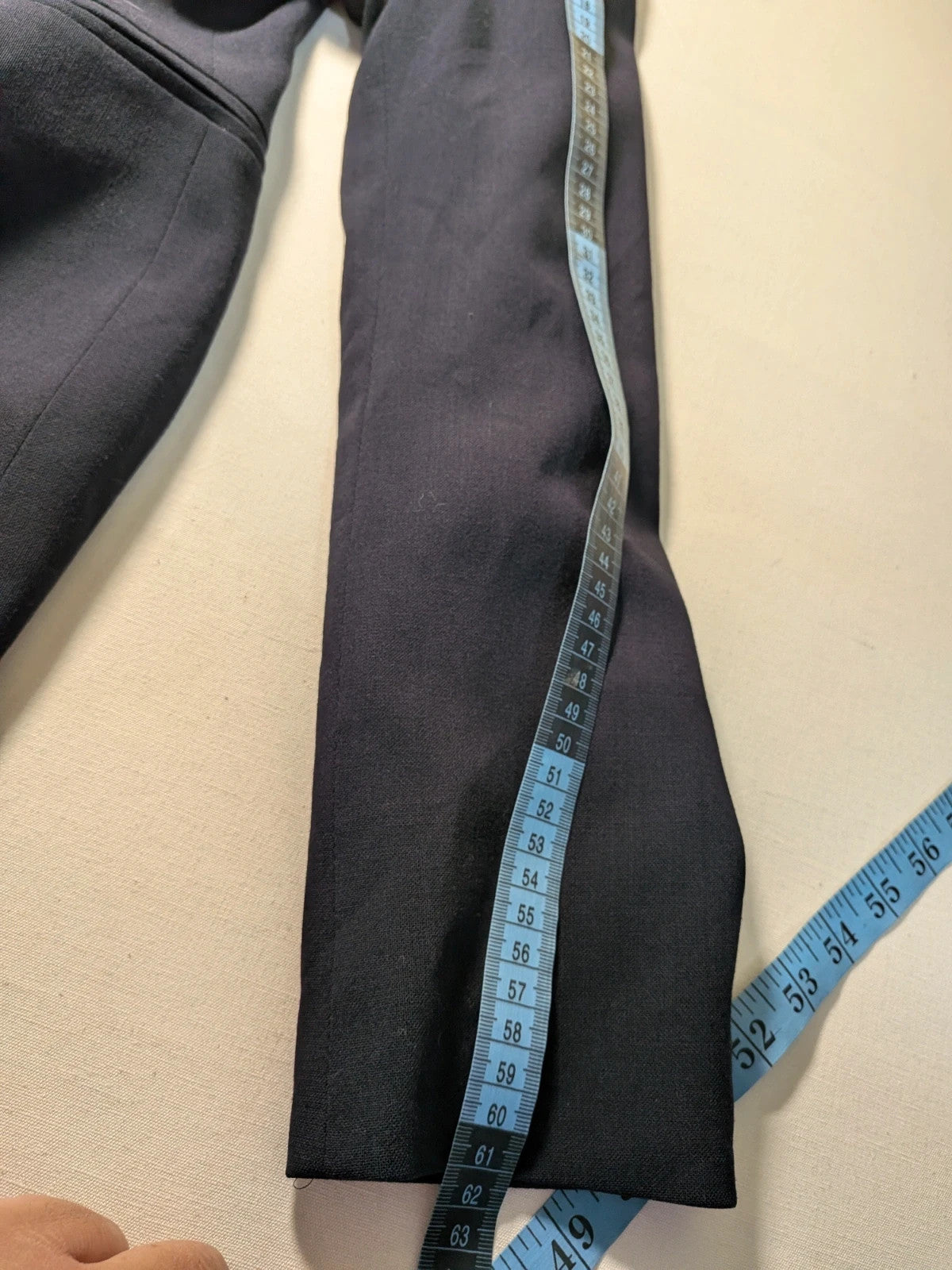 Amuleti navy skirt suit 100% virgin wool, elegant tailored design with button closure.