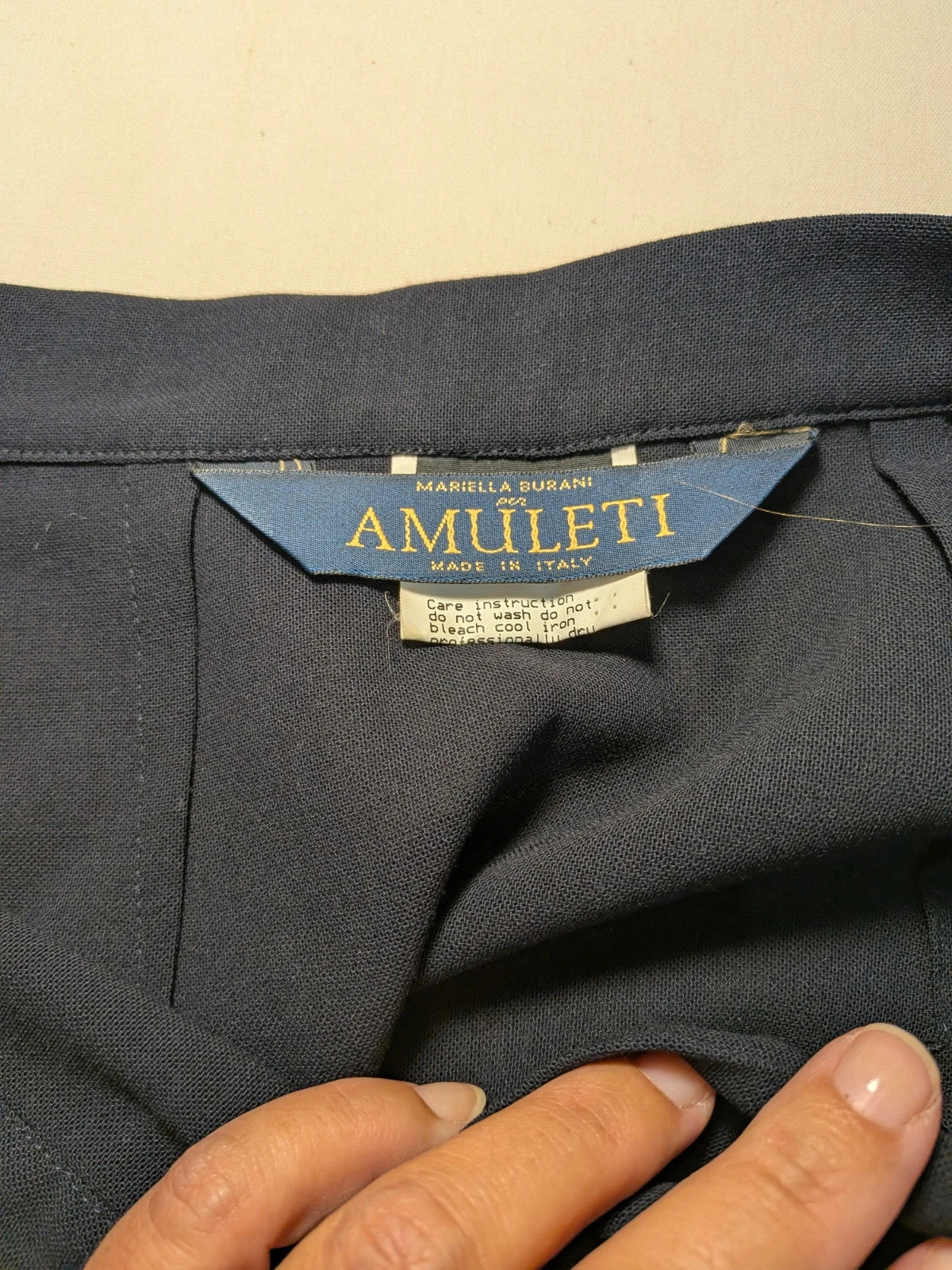 Amuleti navy skirt suit 100% virgin wool, elegant tailored design with button closure.