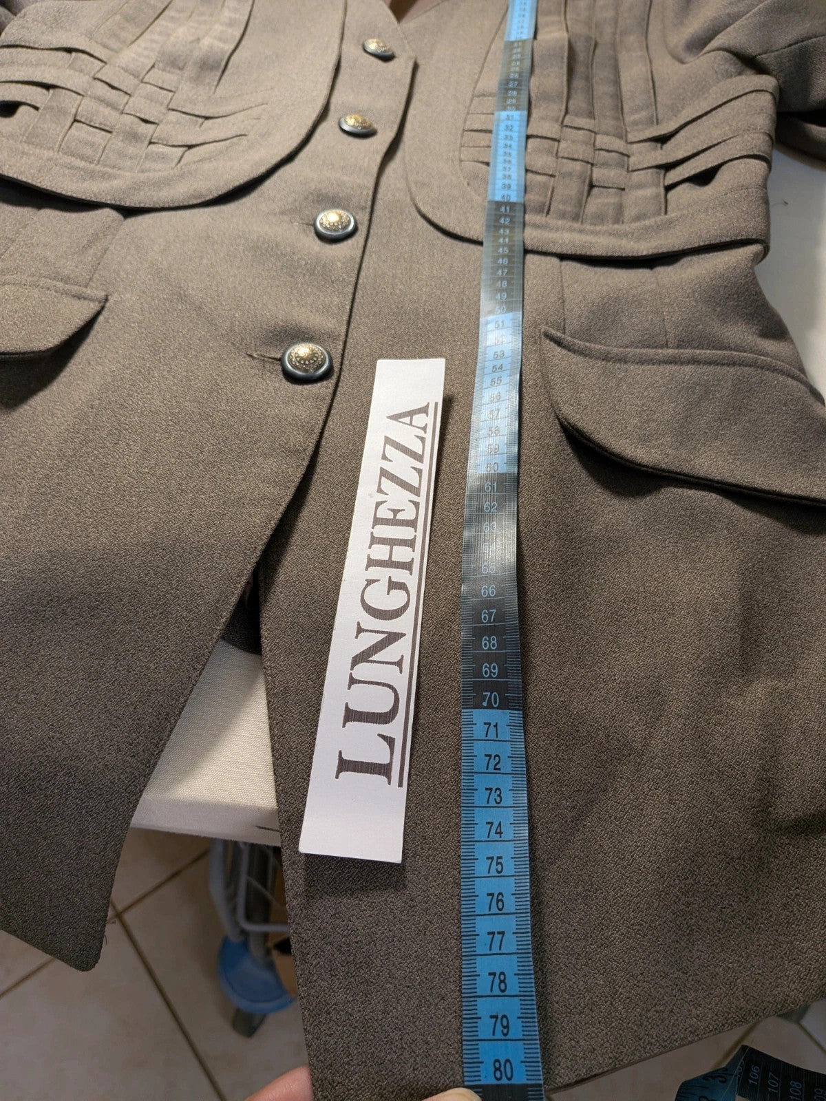 M-Made in Italy grey skirt suit with pleated jacket and decorative buttons.