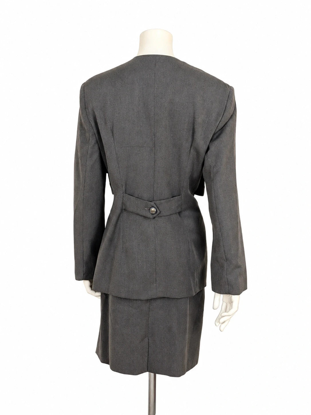 M-Made in Italy grey skirt suit with pleated jacket and decorative buttons.