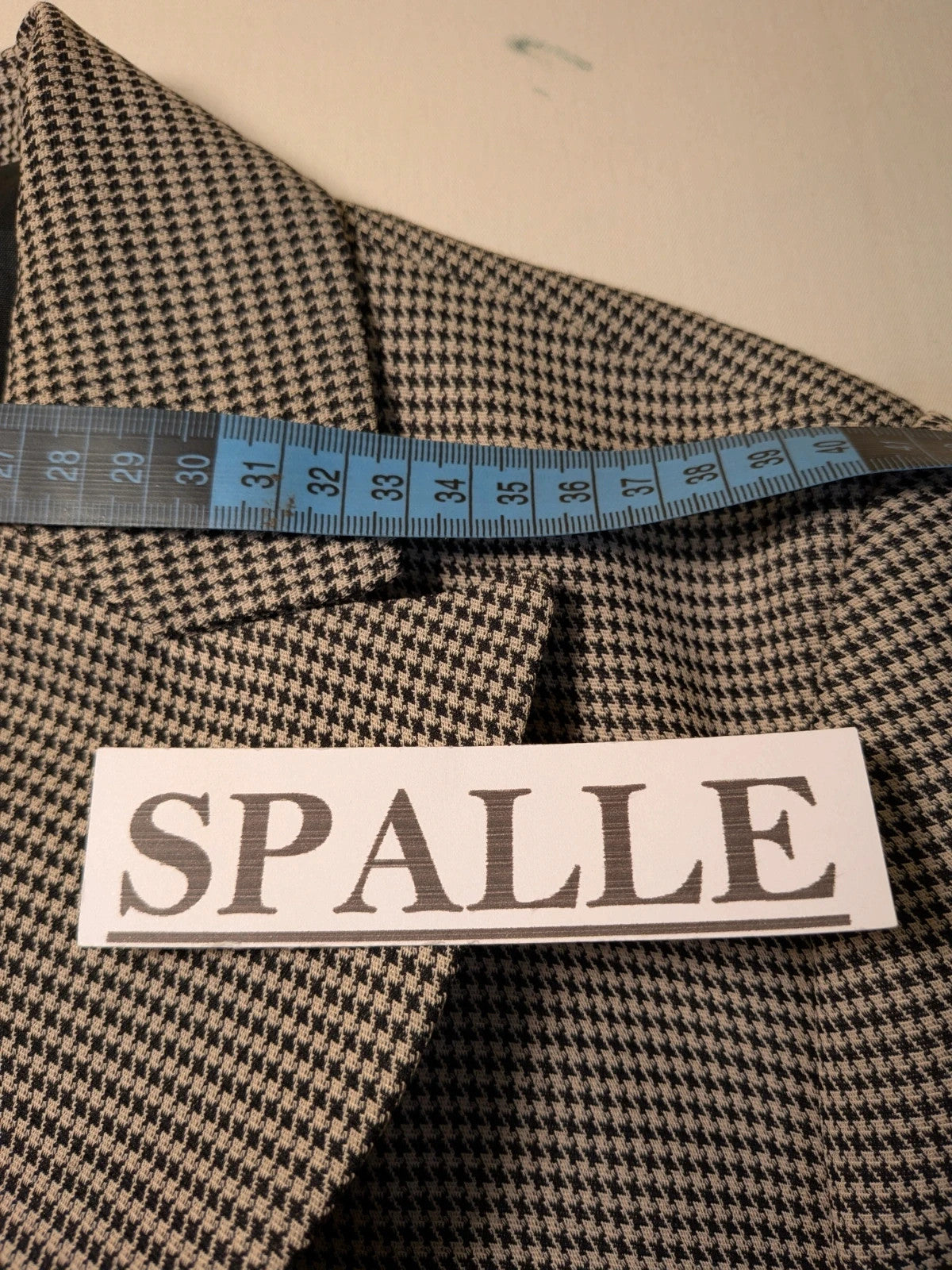 Luca D'Altieri beige and black skirt suit, micro pied de poule pattern, elegant design.