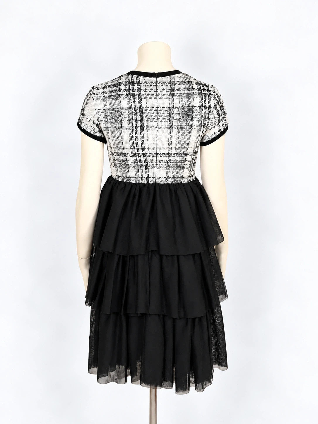 Gaialuna black and white bandage dress with bouclé fabric and tulle ruffles.