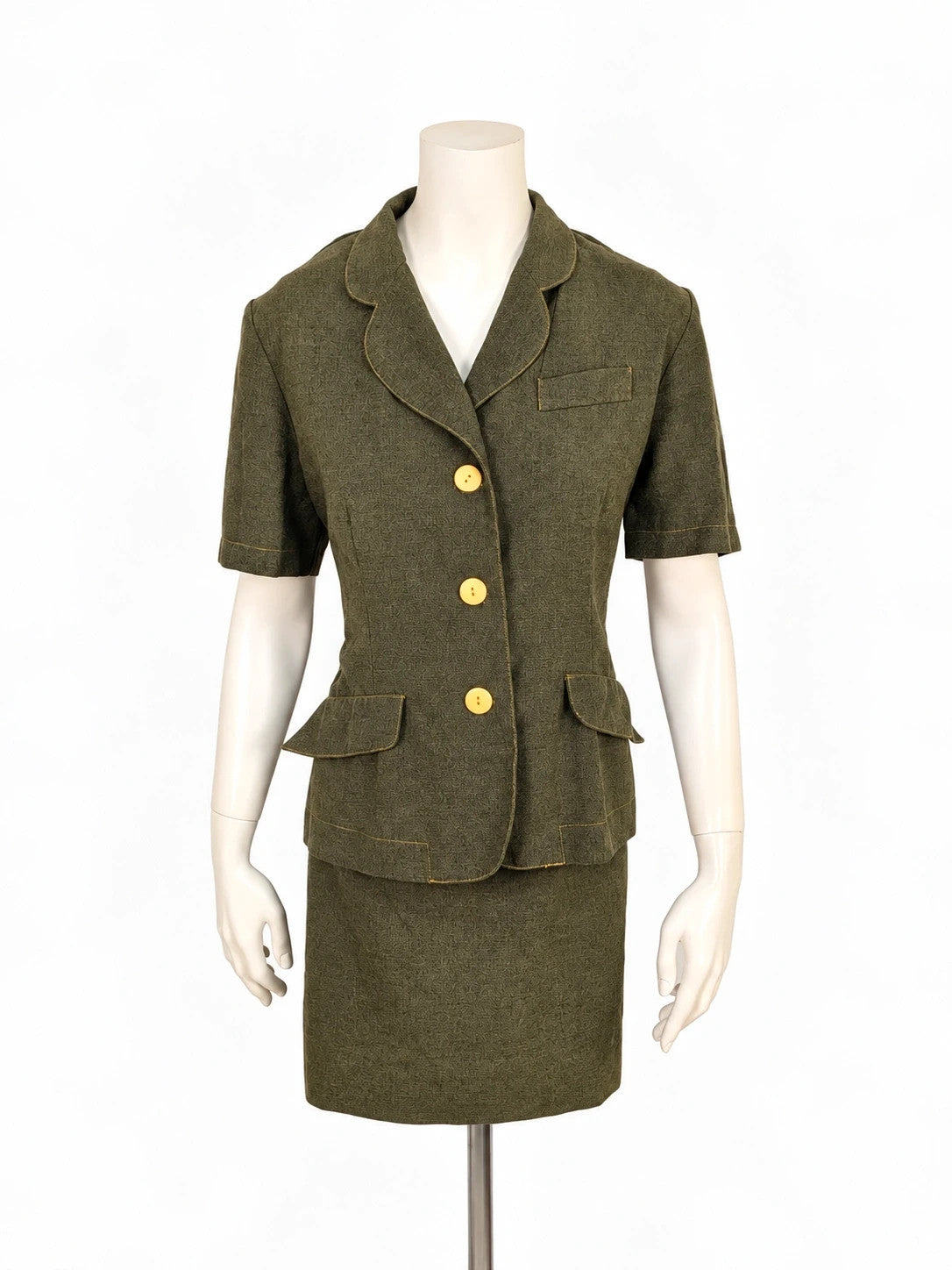 Oliva khaki skirt suit Freeling with textured fabric, short sleeve jacket, and sleeveless dress.