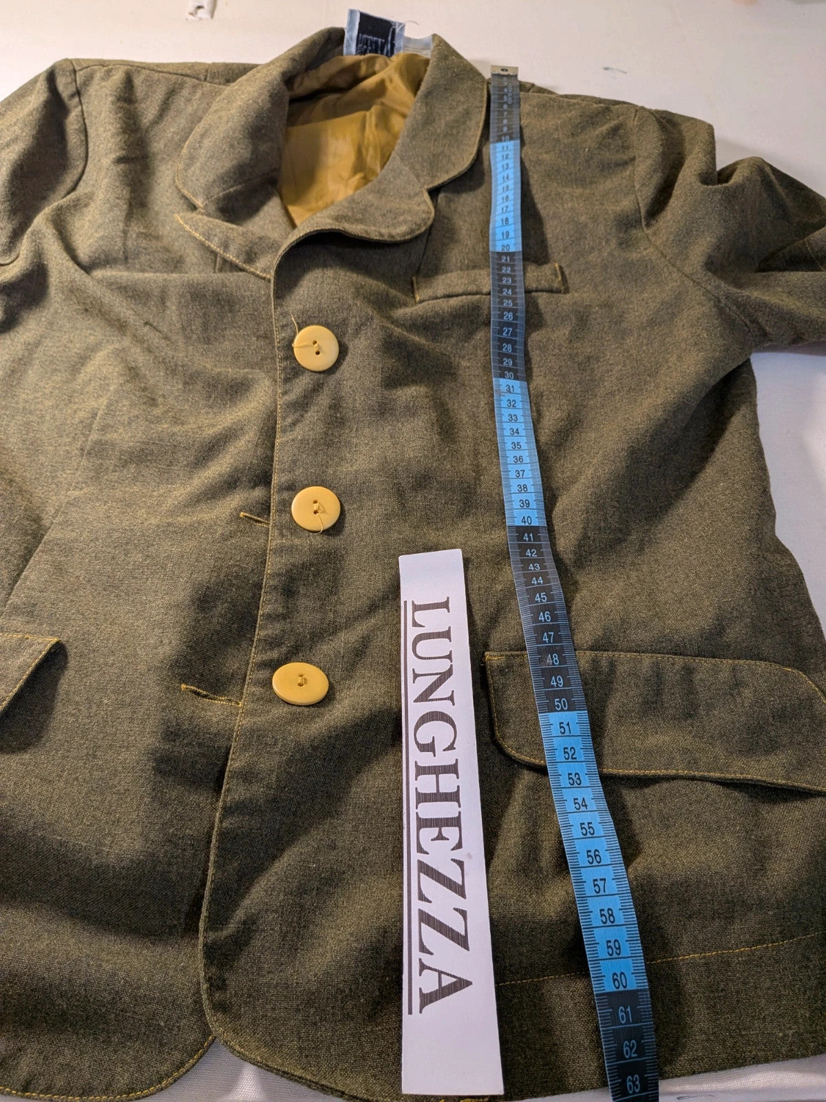 Oliva khaki skirt suit Freeling with textured fabric, short sleeve jacket, and sleeveless dress.