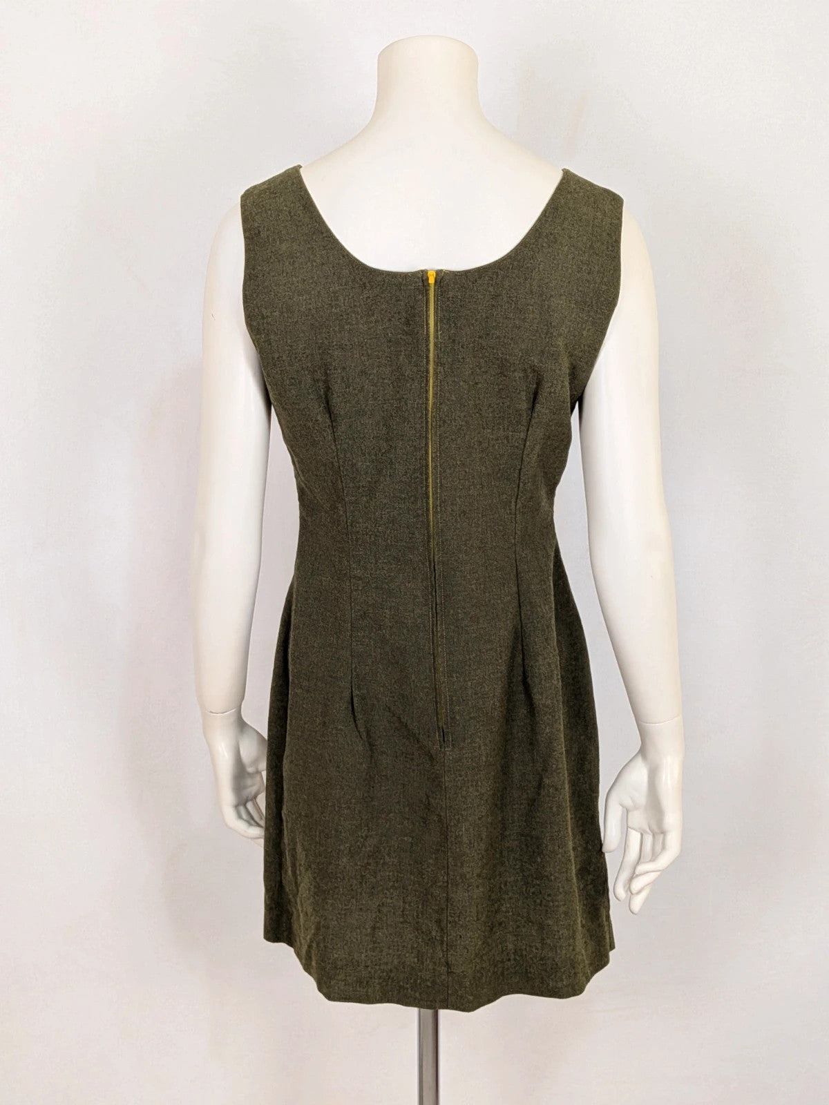 Oliva khaki skirt suit Freeling with textured fabric, short sleeve jacket, and sleeveless dress.
