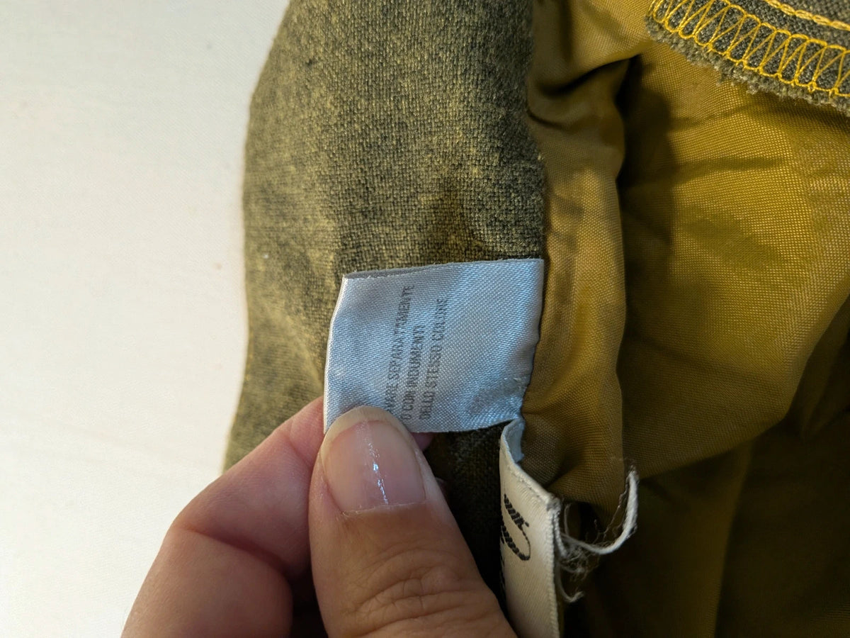 Oliva khaki skirt suit Freeling with textured fabric, short sleeve jacket, and sleeveless dress.